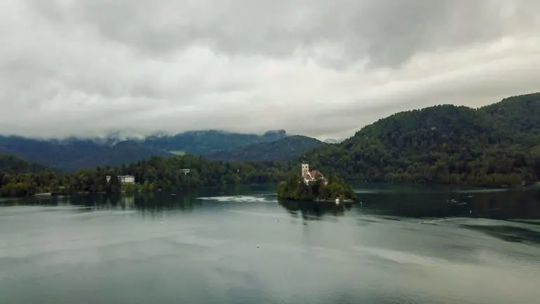 a small island in a lake with a church on it