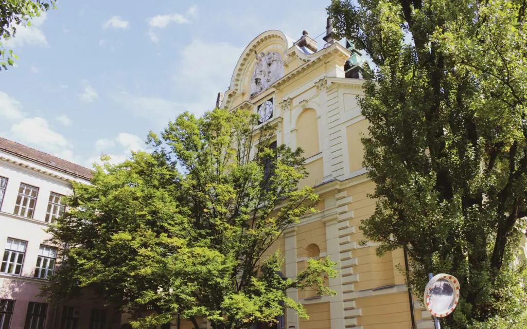 front view of St. James's Parish Church surrounded by trees