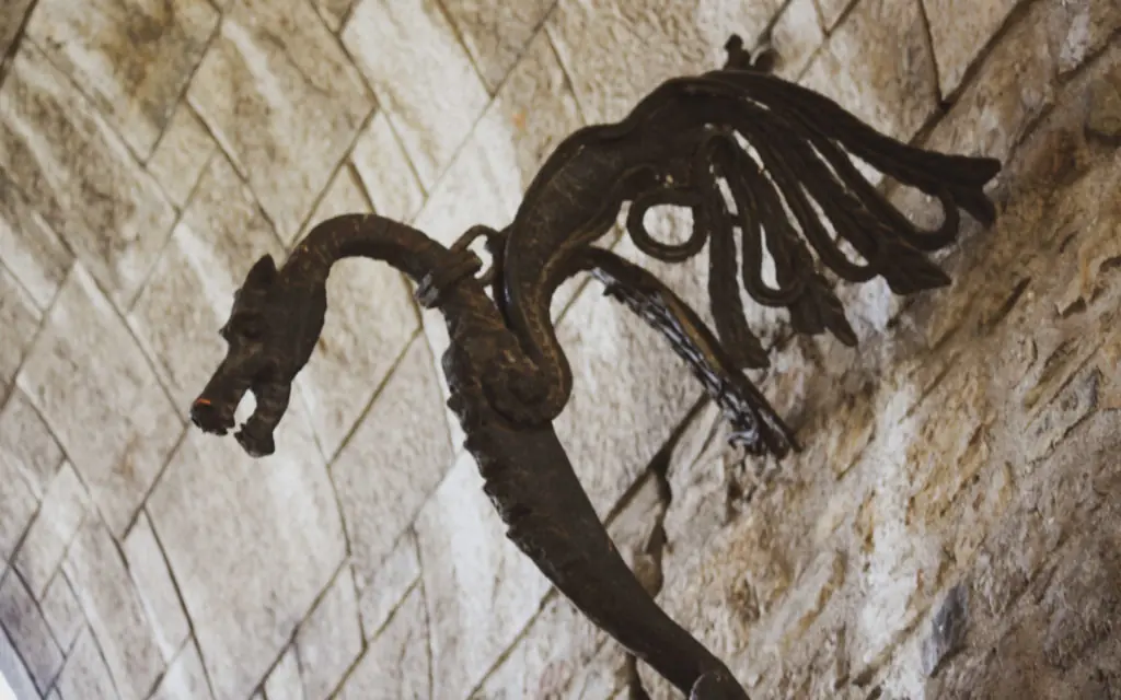 dragon sculpture on a brick wall