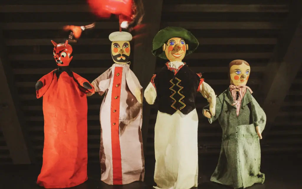 a row of 4 puppets