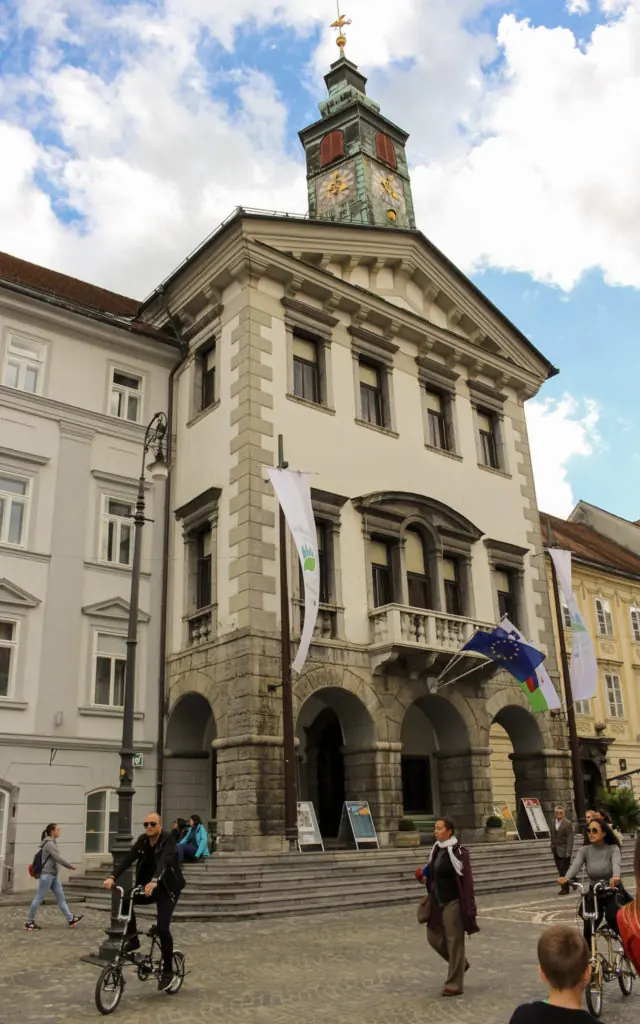 people walking in front of Town Hall in Ljubljana, Slovenia