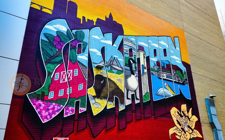 a mural of a city - places to visit in saskatoon